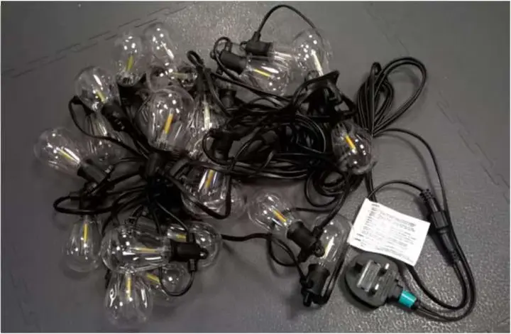 Photo from the official notice: Tomshine 24-Bulb String Lights for Outdoor Use sold via Amazon — electric shock risk