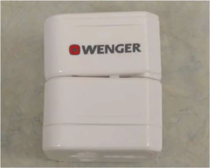 Photo from the official notice: Wenger Universal Travel Adapter 3pc Set White / Wenger Universal Travel Adapter USB White sold by TK Maxx — fire & electric shock risk