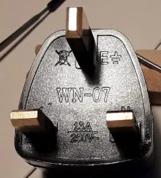 Photo from the official notice: WN-07 Universal Travel Adapter supplied for use with Fiido T1 Pro Cargo E-Bike — electric shock risk