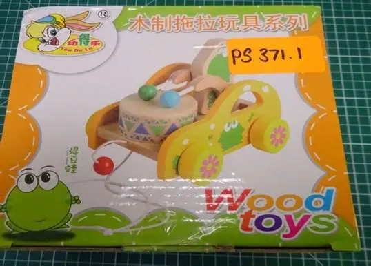 Photo from the official notice: Xtone You De Le Children’s Wooden Pull Along Drum Car Toy — choking & strangulation risk