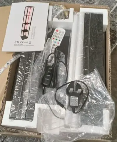 Photo from the official notice: Adapter supplied with Illuminated Shelf Unit — fire risk
