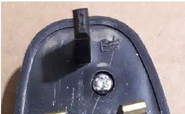 Photo from the official notice: Adapter supplied with V-Benz, Diva Beauty, V-6093 Hair Clippers — electric shock risk