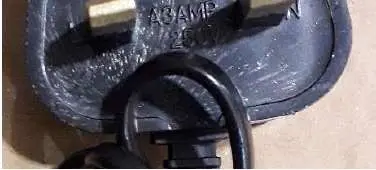Photo from the official notice: Adapter supplied with V-Benz, Diva Beauty, V-6093 Hair Clippers — electric shock risk