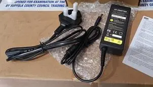 Photo from the official notice: ASUNCELL AC Adaptors sold via Amazon — electric shock risk