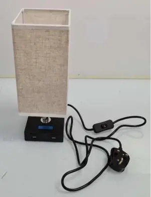 Photo from the official notice: Bedside Lamp with Two USB Ports sold via AliExpress — electric shock risk