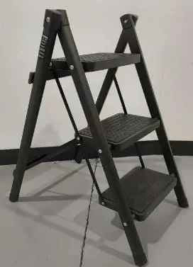 Photo from the official notice: Black Three-Step Folding Ladder — falls risk