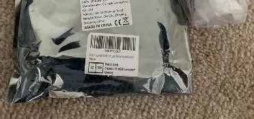 Photo from the official notice: E27 Extension Socket Adapter with Screw — electric shock risk (2104-0040a)