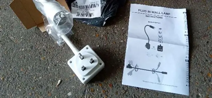Photo from the official notice: Enuotek Plug In Wall Lamp — electric shock risk
