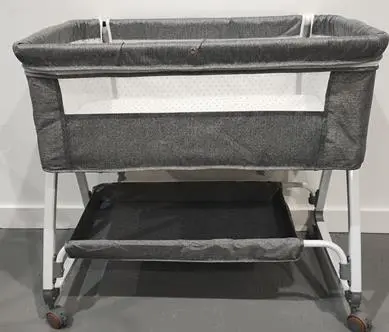 Photo from the official notice: Grey Baby Bassinet — suffocation risk