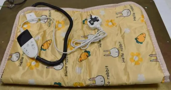 Photo from the official notice: HR Huare Technology Pet Heating Pad sold via Amazon — fire & electric shock risk