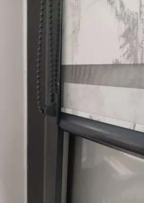 Photo from the official notice: Louvolite Perfect Fit Roller and Vision Blinds Chain Tidy — strangulation risk