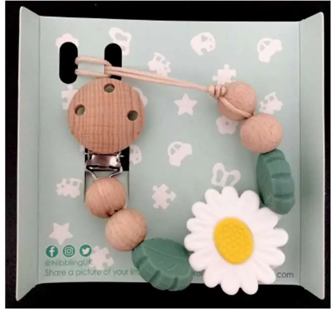 Photo from the official notice: Nibbling silicone daisy dummy ND1000 — choking risk
