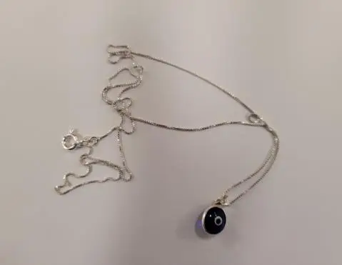 Photo from the official notice: Silver Evil Eye Necklace — chemical risk