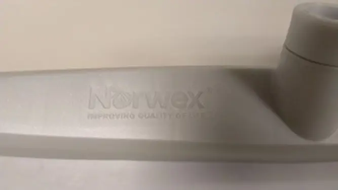 Recalled rubber brooms have "Norwex" printed on the brush head