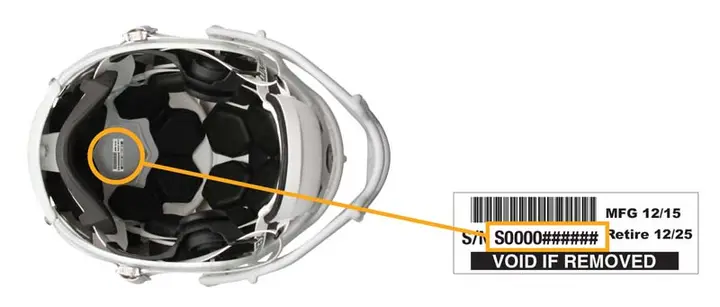 The serial number is printed on a white sticker inside the top of the helmet.