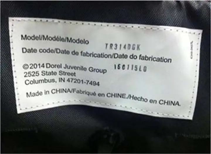 White label with model number on the back of the stroller seat