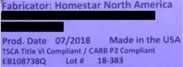 The model number is printed on a label on the back of the recalled dressers.
