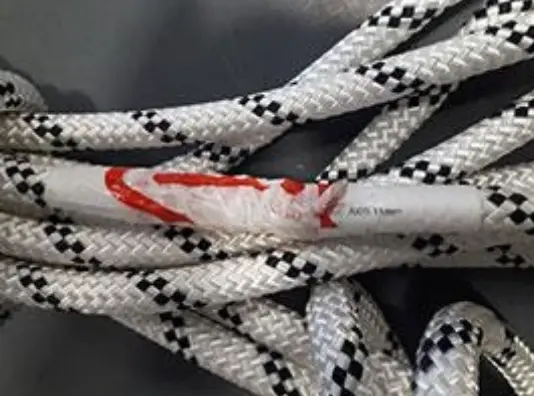 A 2.1-meter scrap of rope taped to one end of an AXIS 11 mm rope
