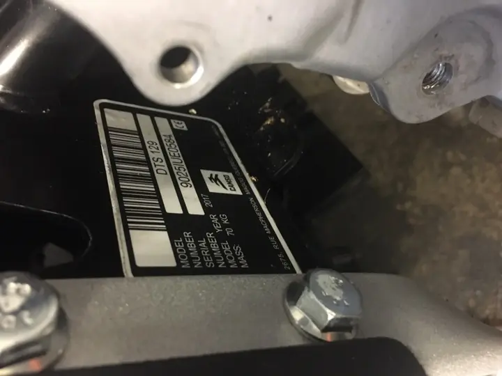 Recalled kit showing model and serial number on front right side of the undercarriage