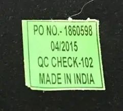 Green sticker affixed to the back of the mirror