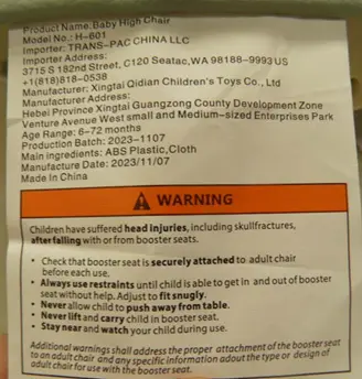 Tag on seat cover of the recalled high chairs with date of manufacture and model number