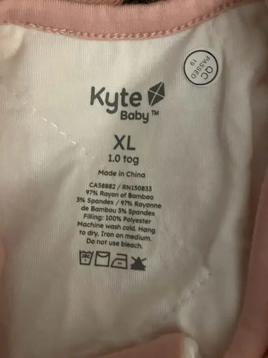 Neck label showing "Kyte Baby" brand, size, and "Made in China"