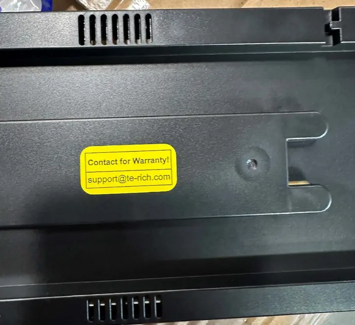 "Contact for warranty! support@te-rich.com" printed on yellow label on back of clock
