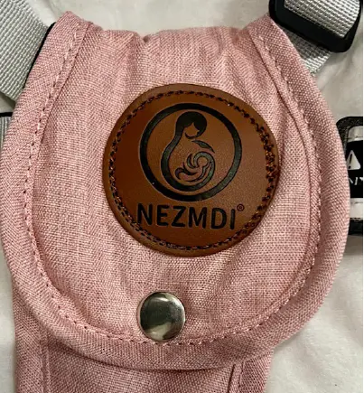 A leather patch with the brand Nezmdi located on restraints