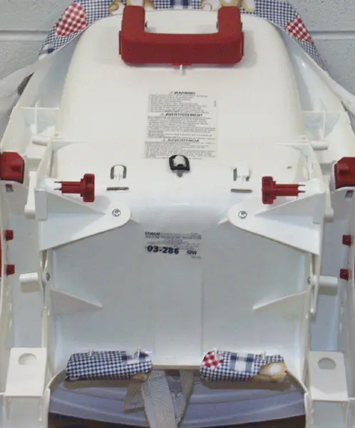 Location of product model and date code on the back of the recalled high chair