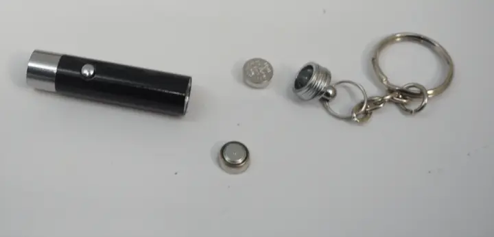 Recalled Anzmtosn Luminous Fidget Spinner Ball Mini Flashlight with batteries removed