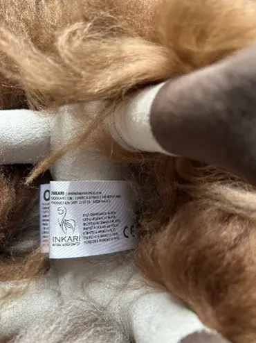 "INKARI" is printed on a label attached to the underside