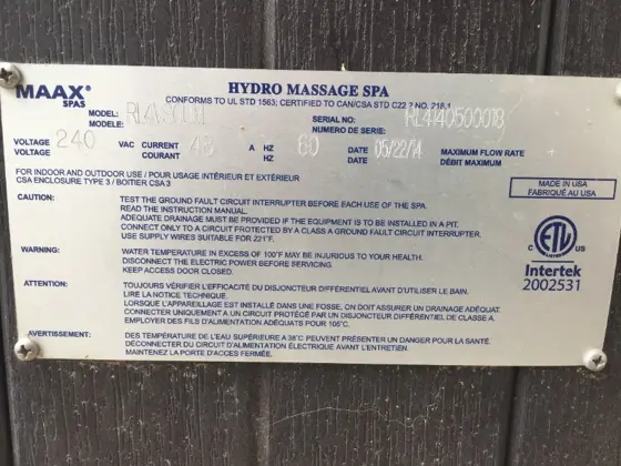 Serial number plate on front corner of hot tub