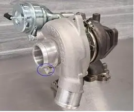 Part Number "3023738" appears on a rectangular area on the passenger side of the turbocharger.