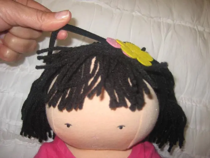 Photo from the official notice: Dolls Recalled by Pottery Barn Kids Due To Strangulation Hazard