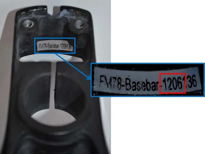 The serial number and date code are inside the base bar on the rear wall.