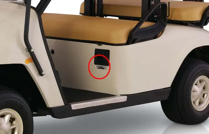 Serial numbers are printed on a plate or label inside the cab below the driver’s seat.