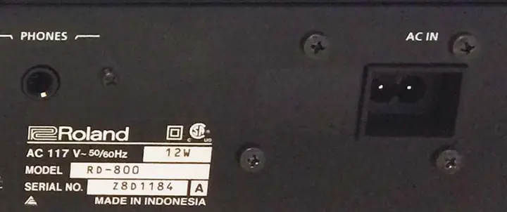 Model number and serial number location on the rear of the piano