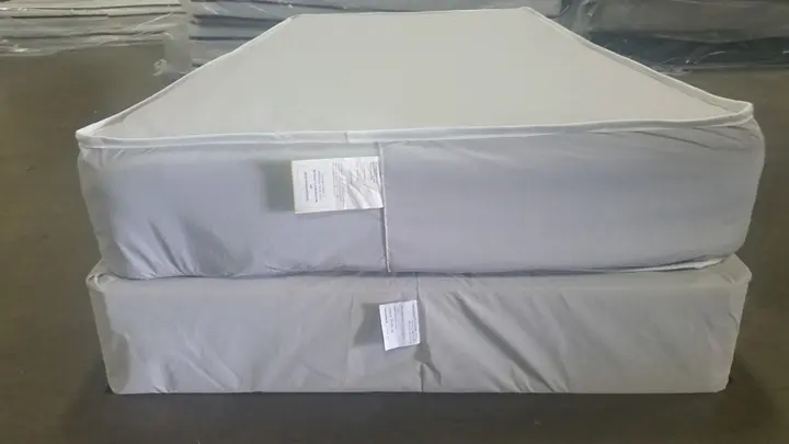 Mattress and foundation with federal tag sewn at the foot of each
