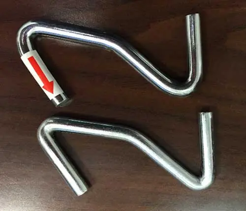 Replacement heavier-gauged S-shaped hook (top) and original Z-shaped hooks (bottom)