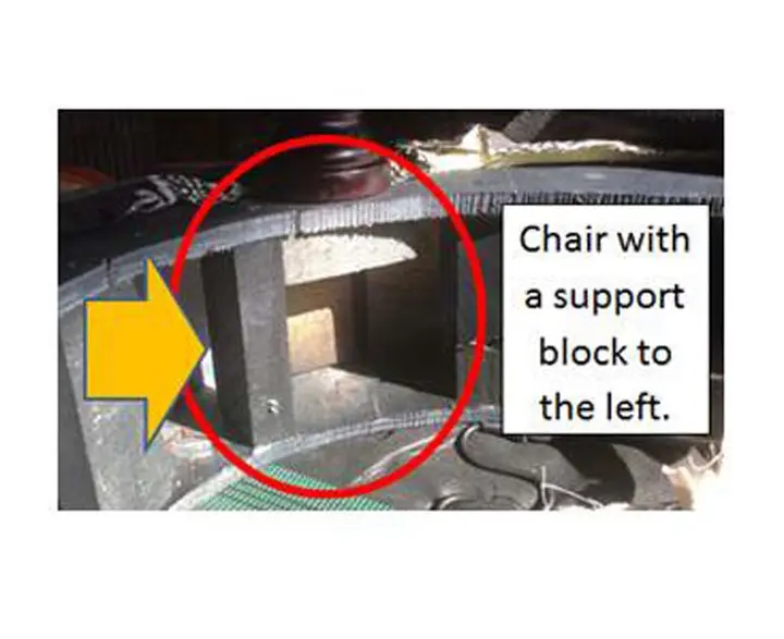 Chair with a support block to the left.