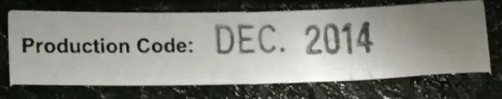 "Production Code: Dec. 2014" is printed on a sticker that can be found by lifting the lining above the right earpiece.
