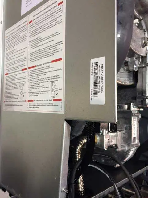 Location of serial number under white cover