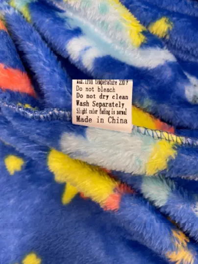 Recalled BTPEIHTD children's robe's side seam label