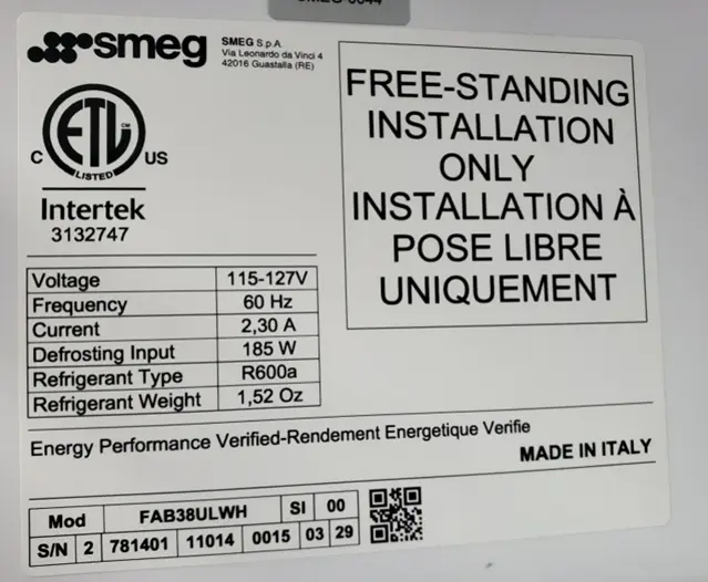 "Made in Italy", the model, and serial numbers are printed on a white label inside of the refrigerator's top door