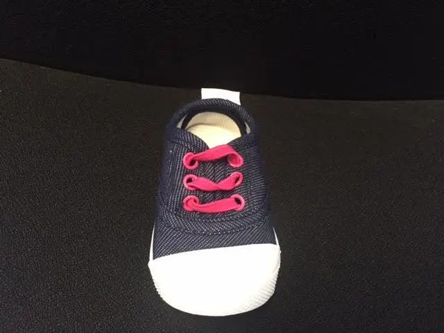 Skidders Footwear denim colored fabric with pink rivets and laces