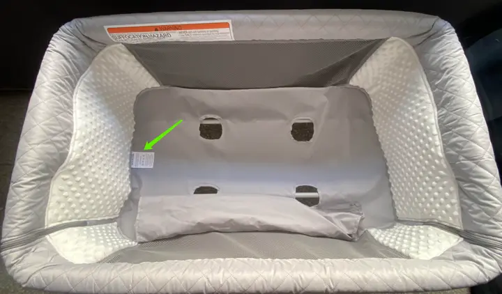 "Product Model: QX-831" is printed on a label located on bottom of the convertible bassinets underneath the mattress pad
