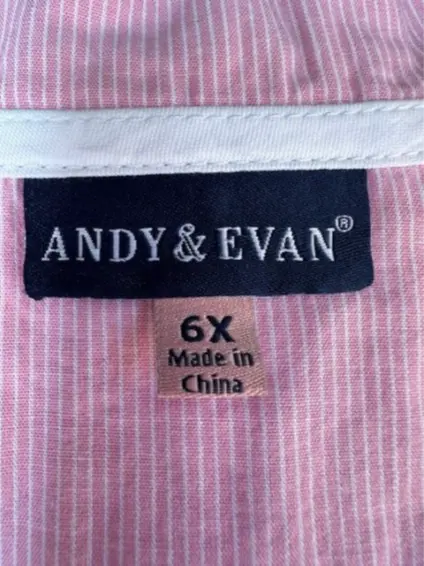 "Andy & Evan" and the size are printed on the sewn-in neck label