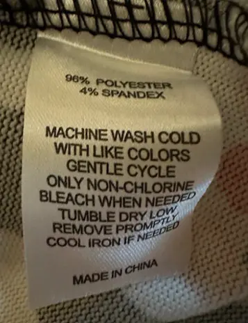 "Made in China", and "96% polyester 4% spandex" printed on the sewn-in side seam label