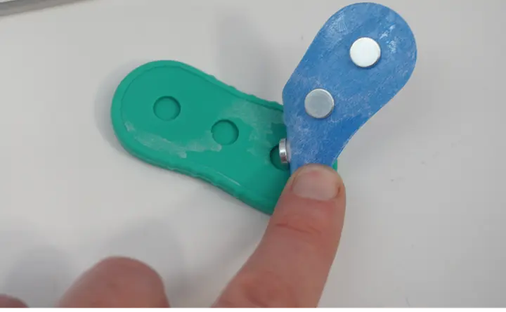 Recalled BUSOHA Magnetic Fidget Slider Toy with silicone casing removed, exposing magnets