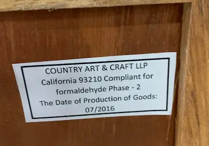 A Label on the back of the recalled Home Decorators Collection Print Block 4-Drawer Whitewash Chest lists the manufacturer and date of production.